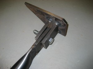 Lower arm for blade pusher